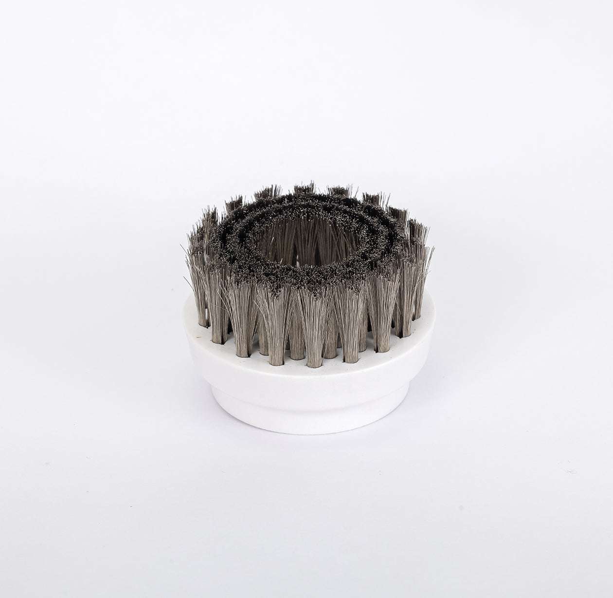 Tiron Hand Scrubber replacement brush head with durable bristles on white base for cleaning surfaces.